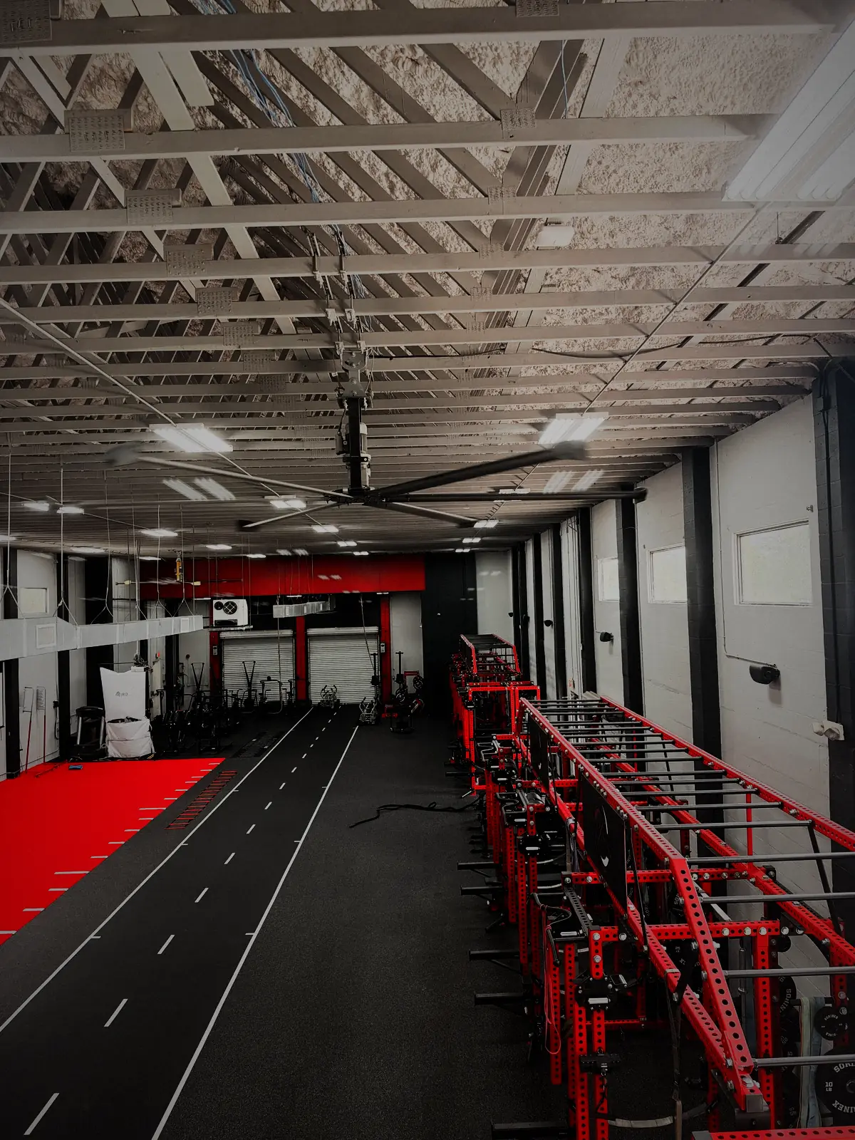 The indoor sprint lane running the length of the MaxOut360 facility