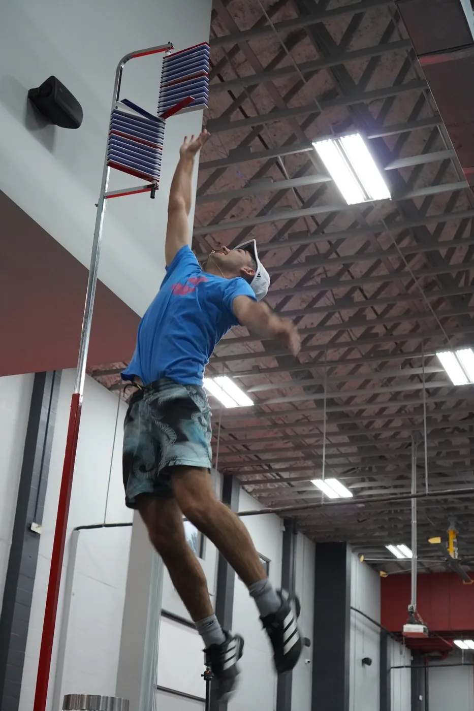 An athlete mid-air during a vertical jump test